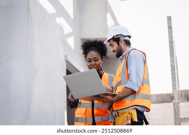 In the Industrial Engineering Facility: Diverse Group of Engineers, Technicians, and Specialists on a Meeting, Have Discussion, Analyse Engine Design Technical Drafts that are Lying on the Table - Powered by Shutterstock