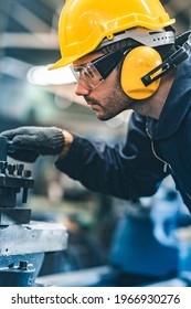 Industrial Engineers In Hard Hats.Work At The Heavy Industry Manufacturing Factory.industrial Worker Indoors In Factory. Man Working In An Industrial Factory.Safety First Concept.