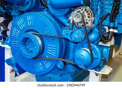 Industrial Equipment Engine Close-up. Blue Industrial Engine With Belts. Concept - Repair Of Industrial Engines. Sale Of Manufactured Diesel Equipment. Fragment Of A Diesel Engine Close Up.