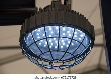 Industrial explosion-proof lantern of black and gray shines with white light at coal mining exhibition