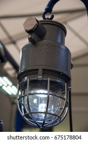 Industrial explosion-proof lantern of black and gray shines with white light at coal mining exhibition