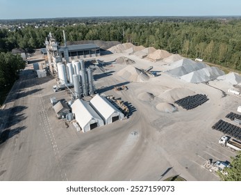 Industrial Facility with Extensive Sand and Gravel Storage and Machinery. Top view of industry manufactory - Powered by Shutterstock