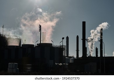 industrial factory chimneys with a release of polluting gases into the environment