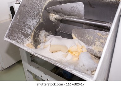 Industrial factory, machinery for making raw materials, a machine for mixing dough, kneading dough at the bakery, confectionery, equipment for making flour products - Powered by Shutterstock