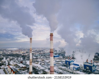 Industrial factory smokestack emission smoke from natural gas in atmosphere. Industry zone, factory smoke plumes. Global energy crisis