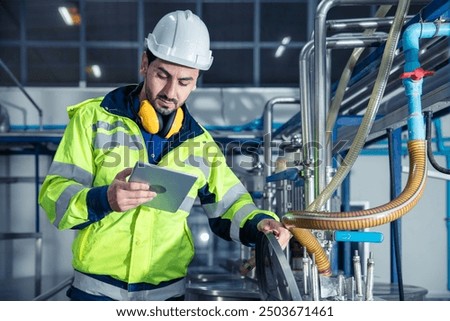 Industrial factory worker, Engineer staff working in food and drinks factory, Control check quality condition of liquid pipe supply in plant.