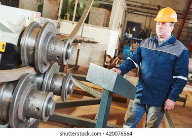 Industrial Factory Worker With Tube Bending Machine