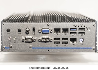 Industrial fanless embedded computer with multiple connectivity ports including HDMI, VGA, Ethernet, USB, and serial connections for server hosting applications.