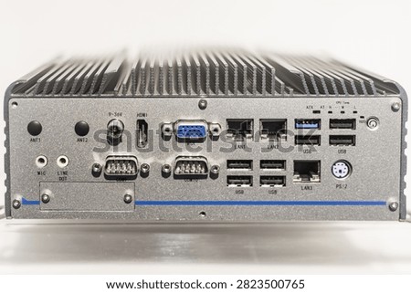 Industrial fanless embedded computer with multiple connectivity ports including HDMI, VGA, Ethernet, USB, and serial connections for server hosting applications.