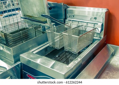 Industrial Fryer In The Restaurant For The Preparation Of Harmful To Health But Delicious Food