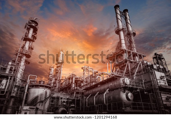 Industrial furnace and heat exchanger cracking\
hydrocarbons in factory on sky sunset background, Close up of\
equipment in petrochemical\
plant