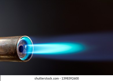 Industrial Gas Burner With Blue Flame, Close Up Shot In The Dark