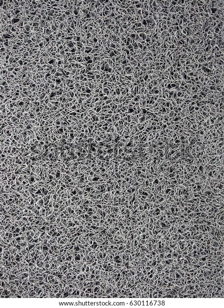 Industrial\
grey vinyl carpet Coil Pattern Car Floor Mat texture. Close up anti\
slippery surface vinyl dust background\
image.