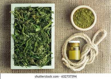 Industrial Hemp Plant Products: Tea, Oil, Rope And Protein Powder On 100% Hemp Fabric