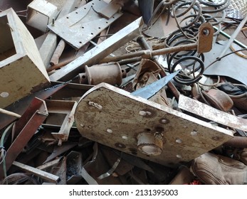 Industrial iron scrap piled on the blacksmith workshop. Old metal iron scrap piled. Scrap Metal Piled up in front of a shop that a poor family collects to sale to make a living. Industrial concept. - Shutterstock ID 2131395003