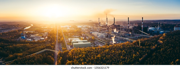 industrial landscape with heavy pollution produced by a large factory - Shutterstock ID 1356321179