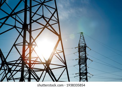 industrial landscape. Silhouette High voltage electric tower on sunset time and sky on sunset time background.