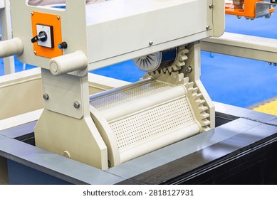 Industrial machine close-up, technical concept, white cylindrical component, filtering mechanism, industrial setting, indoor factory, control panel, precision engineering, bright even lighting, clean