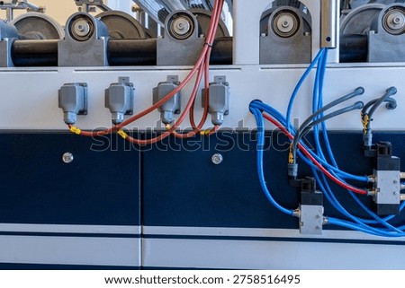 Industrial Machine Control Panel with Electric Cables and Pneumatic Lines
