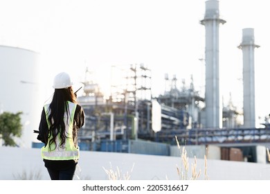 Industrial Maintenance Engineer Woman Wearing Uniform Helmet And Safety Under Inspection And Inspection Of Production Process In Factory Station. Industry, Engineer, Construction Concept