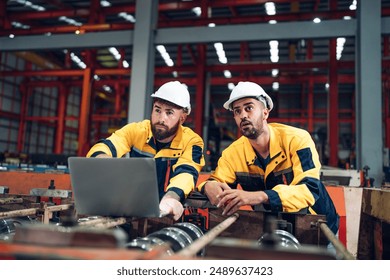 Industrial man engineer wear uniform and helmet using laptop are checking system machine at factory. Workers industrial factory. Machine maintenance technician operation concept. - Powered by Shutterstock