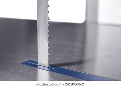 industrial meat processing equipment,
band saw for meat,
food production,
isolated - Powered by Shutterstock