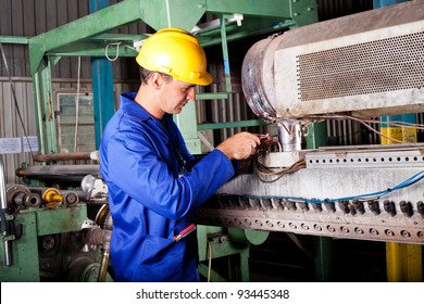 Industrial Mechanic Repairing Heavy Industry Machine In Plant