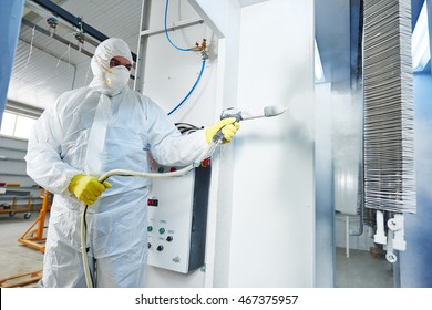 Industrial Metal Coating. Man In Protective Suit, Wearing A Gas