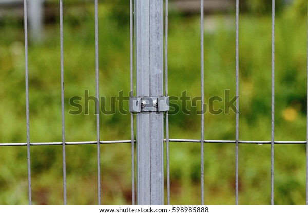 Industrial\
metallic fence on car racing speed\
track