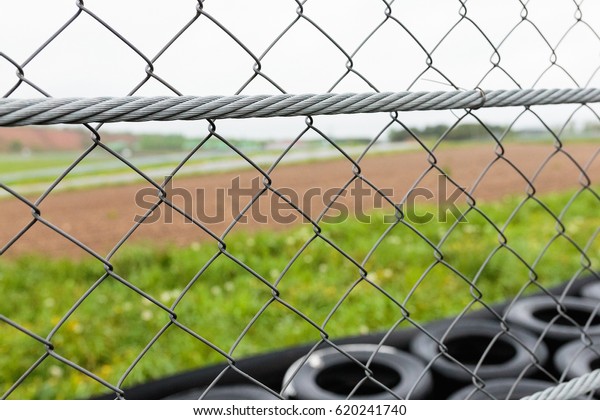 Industrial
metallic fence on car racing speed
track