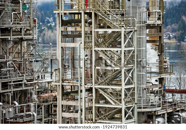 Industrial\
object refining oil and other toxic materials, working and steaming\
on a gloomy day, refinery processing oil into gas and fuel. Energy\
industry structure, loud and ugly\
looking.