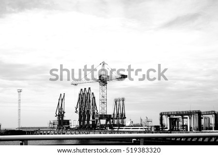 Similar – Pastel evening atmosphere at the harbor basin with cargo cranes