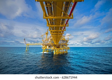 Industrial Offshore oil and gas rig platform with beautiful sky 