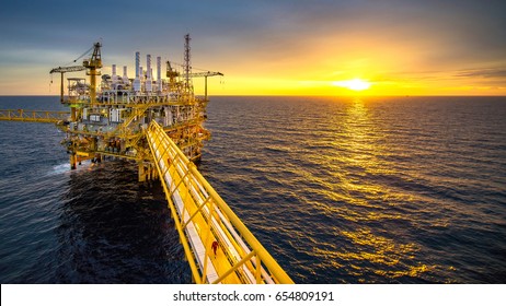 Industrial Offshore oil and gas rig platform with beautiful sky in the gulf of Thailand.