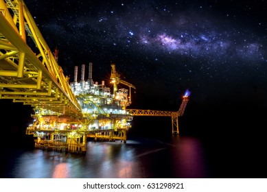 Industrial Offshore Oil And Gas,Oil Rig Platform With Milky Way At Night