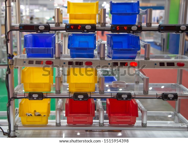 Industrial open plastic bin rack for component\
parts in warehouse\
factory