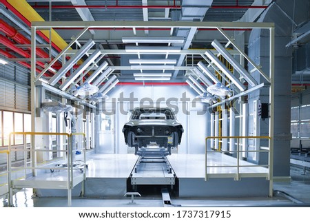 industrial paint booth cars repair station. Spray painting high quality in the industrial cabinet painting booth cars repair station of vehicles production line process in factory 