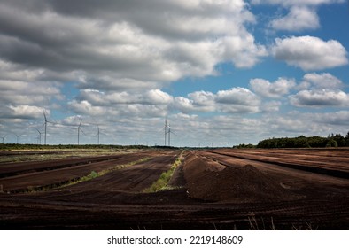 Industrial Peat Extraction On Peatlands In The Midlands Of Ireland. This Is Now Almost A Thing Of The Past, All Turf-fired Power Plants Are Closed. Windmills Are Placed On The Cutover Bogs