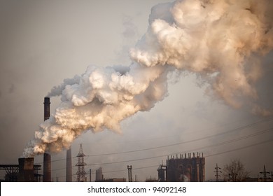 Industrial Plant With Yellow Smoke. Air Pollution Concept