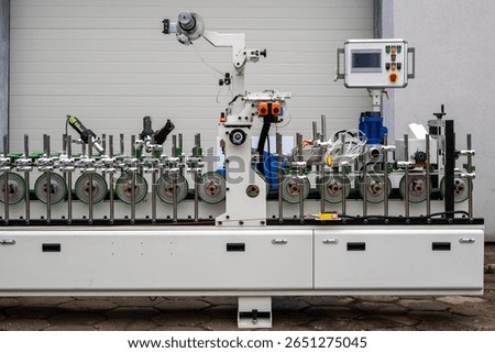 Industrial Processing Unit with Rollers, Handheld Tools and Control Panel – Smart Factory System
