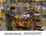 Industrial production of car automobiles. Plant for assembling modern cars on an assembly line. Industry, production, industry concept.