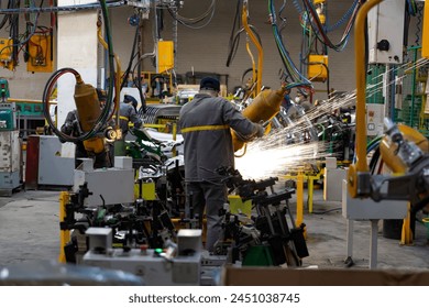 Industrial production of car automobiles. Plant for assembling modern cars on an assembly line. Industry, production, industry concept.