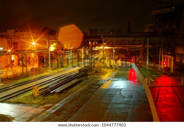 Industrial rail yard
shunting station at night with many lights and wagons on a siding
in an industrial
plant