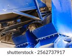 Industrial recycling conveyor processing shredded waste materials for sustainable disposal and reuse.