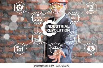 Industrial Revolution IT Integration Smart Manufacturing Innovative Information Technology Industry 4.0 Concept. Businessman offers gear industrial revolution icon on virtual screen. - Shutterstock ID 671430379