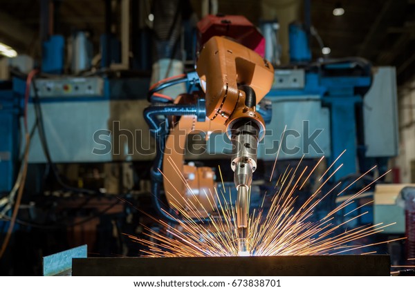 Industrial robot is welding test run program in\
car factory