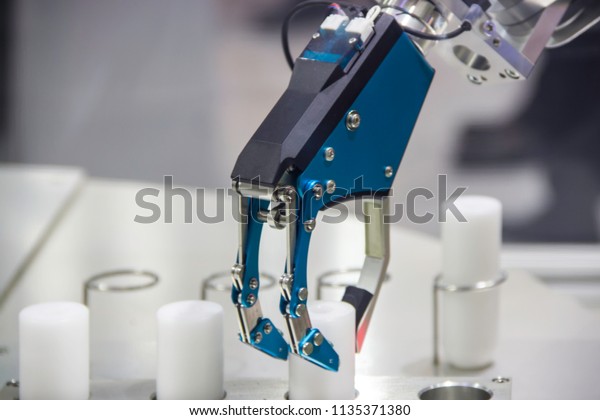 Industrial robot working in factory,Industry 4.0 Robot
concept .