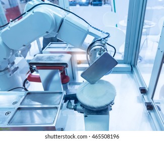 Industrial Robot Working In Phone Factory