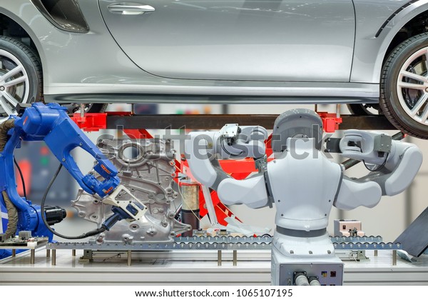 Industrial robotic installed 3D scan device to\
scanning auto parts for measuring data and robotic maintenance car\
to work automation on blurred control background, industry 4.0\
concept