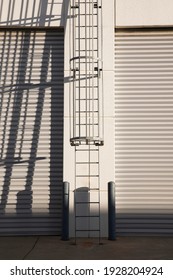 Industrial Roof Access Ladder Dispatch Warehouse Roller Doors.